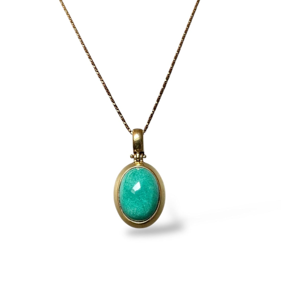 70s Made in Italy 18k solid gold Necklace with Beautiful Turquoise pendant Necklace: 70s Made in Italy 18k solid gold Necklace with Beautiful Turquoise pendant Necklace Pendant size mm 16x12x6.4 Necklace weight: 9.9gr SKU: 105p Our company's certification is available for free, upon r