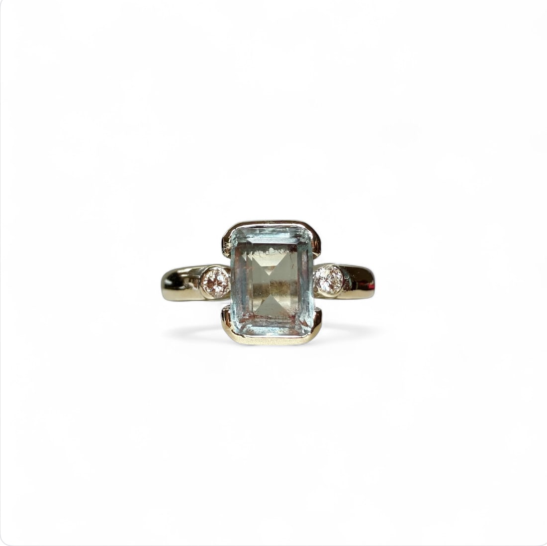 Sober and Classic Aquamarine Ring enriched with 0,06ct natural diamonds set on 18k solid gold: Sober and Classic Aquamarine Ring enriched with 0,06ct natural diamonds set on 18k solid gold Aquamarine size = mm9x7 Size: US 6+3/4 SKU: 77/20A Our company's certification is available for free, upon