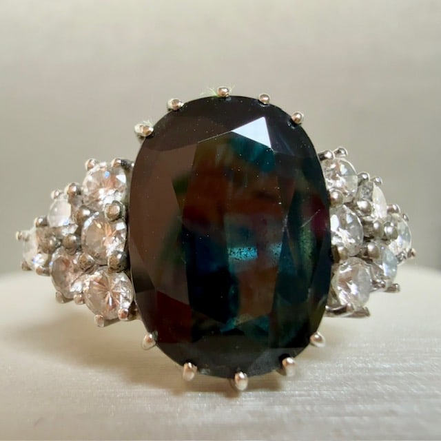 Gorgeous 18k Solid Gold Ring with black-blue shades natural Sapphires and 0.36ct natural Diamonds: Gorgeous 18k Solid Gold Ring with rare black-blue shades natural Sapphires and 0.36ct natural Diamonds Made in Italy Ring size: US 7+3/4 Sapphire size: 13.5 x 8.2mm 12 natural diamond weighing 0.36ct 