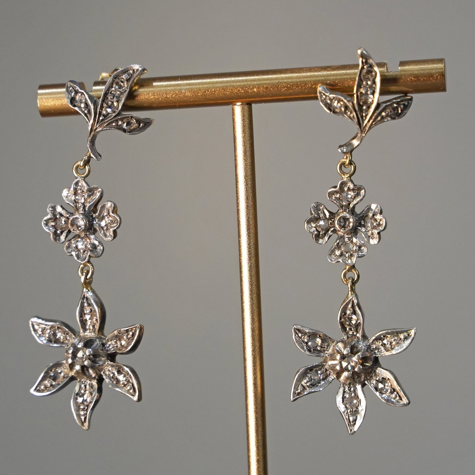 Artistic Vintage 18K Yellow Gold & Silver Floral Drop Earrings with 0.85ct Old Diamonds , 13gr: An Artistic pair of vintage-inspired floral drop earrings crafted in 18K yellow gold and silver. The design features elegant rosette motifs with a balanced pendulum silhouette, completed by post and b