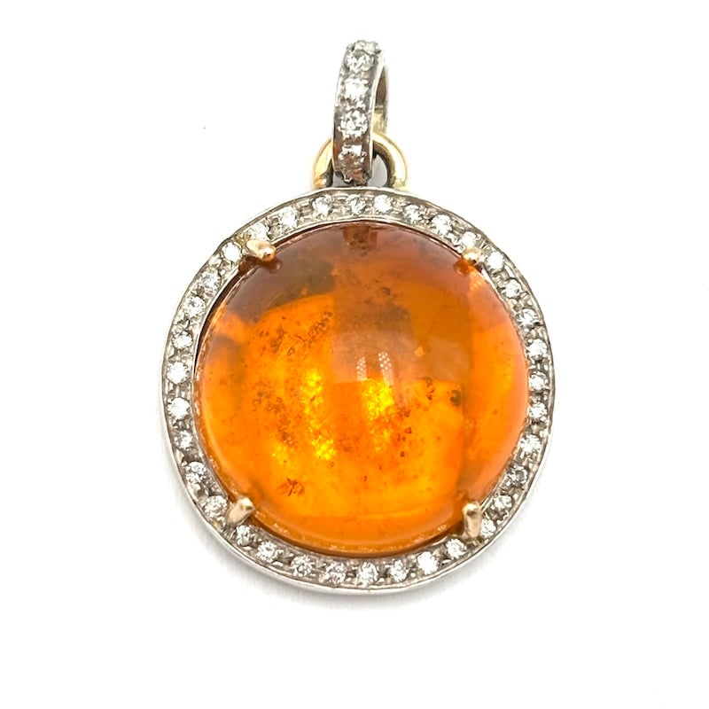 Fire opal, brilliants and gold pendant; 5.7 gr.: Gorgeous, very bright and dramatic circular pendant in two-tone 18 kt gold with crazy orange fire opal surrounded by brilliants. An unusual, intense and unforgettable touch of distinctive femininity! 