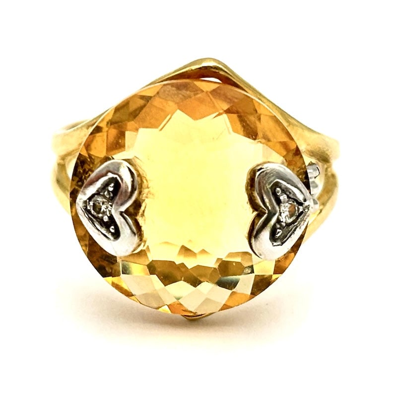 Hydrothermal citrine quartz, gold and hearts ring with brilliants; 6.17 gr: Bright and sunny vintage ring in 18 kt yellow and white gold, with hydrothermal citrine quartz and small hearts with double glitter . Linear and exquisitely ethnochic setting, for a beautiful occasion
