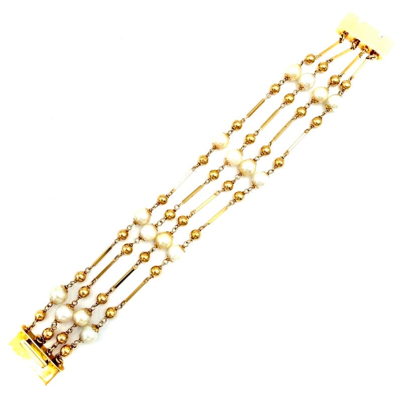 Bracelet 4 strands bars, yellow gold balls and Akoya pearls; 19 cm - 32.2 gr.: Extraordinary multi-strand bracelet of Japanese Akoya pearls, alternating berets and beads, in 18 kt yellow gold. Sophisticated, precious and unusual scenic occasion of four bracelets in one! Our comp