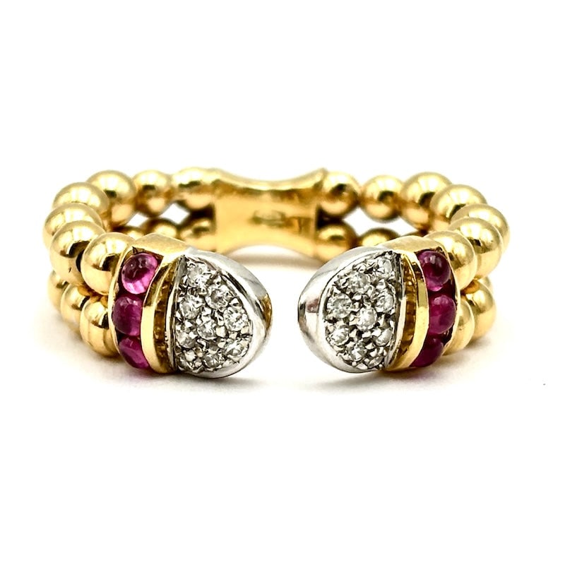 Open ring yellow gold beads, rubies, diamonds; 5.94 gr.: Adorable front open double band vintage ball ring in 18 kt yellow gold, with double trio of cabochon-cut rubies on the sides and glitter as a concluding decoration. A unique, exquisite, comfortable, t