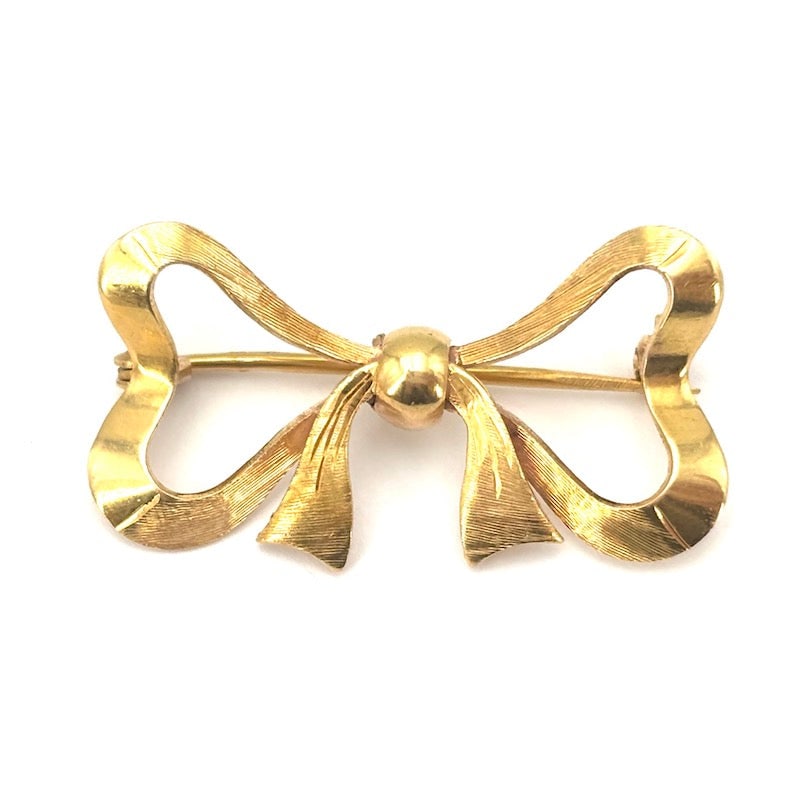 Vintage yellow gold bow brooch - 4.35 gr.: Adorable vintage bow brooch, romantic classic in 18 kt yellow gold. The unmistakable sartorial style that will never fade in a vexatious, total gold piece of jewelry!!! Our company's certification is 