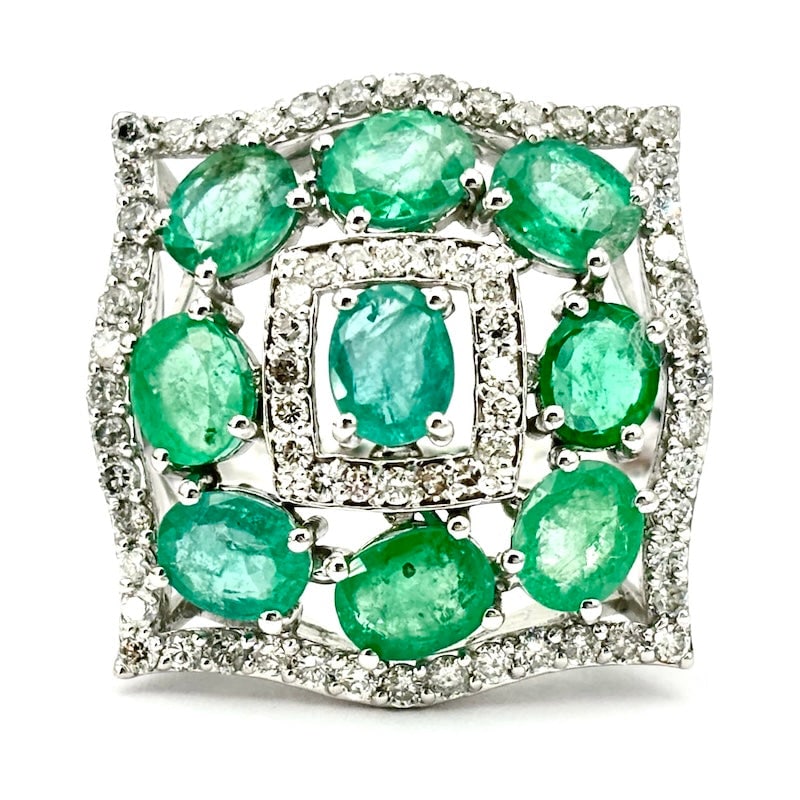 Emeralds and brilliants ring, gold; white 6.21 gr.: A green and white and hyper precious dream! Square wave ring in 18 kt white gold with beautiful oval-cut flower emeralds framed by white brilliants. An impressive composition from WOWWWW!!!! Breathtak