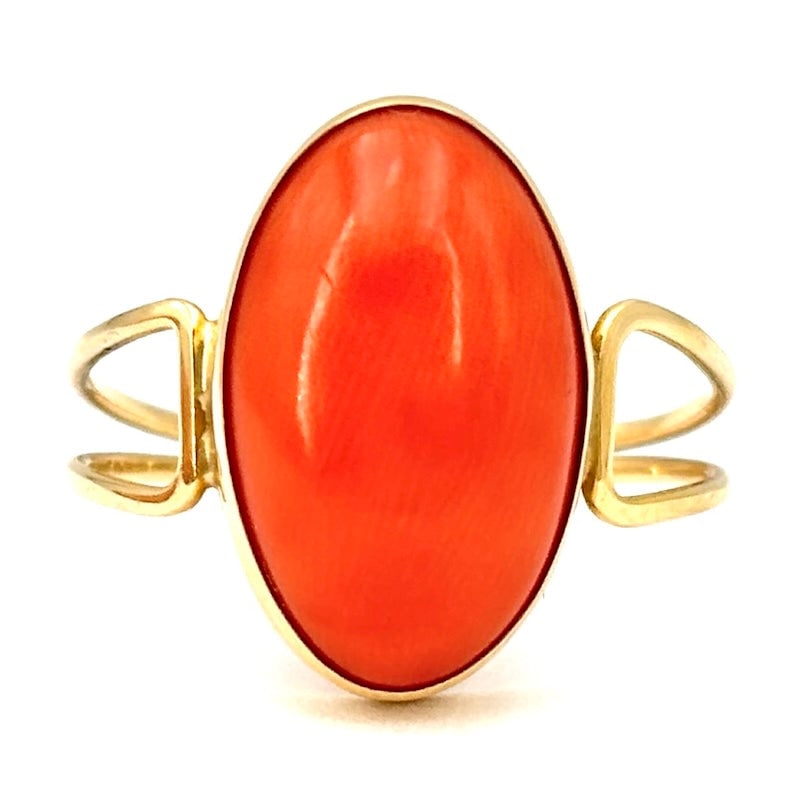 Momo coral and yellow gold ring; 2.56 gr.: Beautiful, essential, yet precious ring, 18kt yellow gold, double shank, with central oval cabochon of natural momo coral. Intense, comfortable and passionate jewelry. Our company's certification is a
