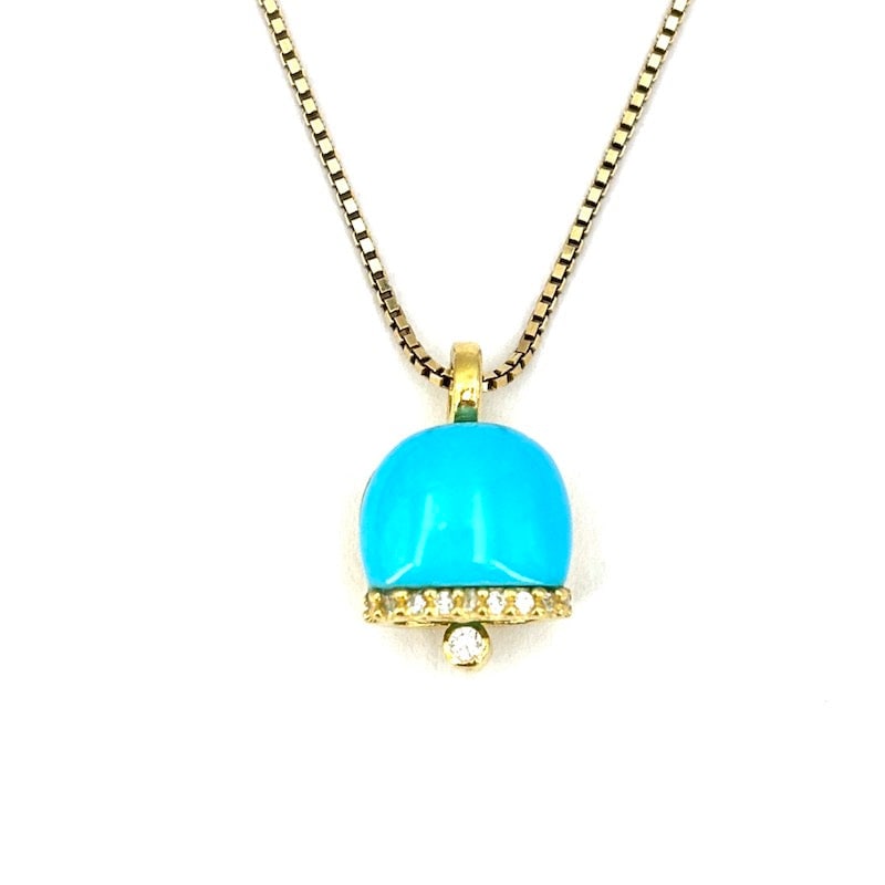 Natural turquoise and gold-plated silver bell pendant; 3.1 gr.: A playful and eye-catching bell-shaped pendant in gold plated 925 silver, adorned with a shaped natural turquoise and shimmering zircon accents. The design features openwork details and a moving clapp
