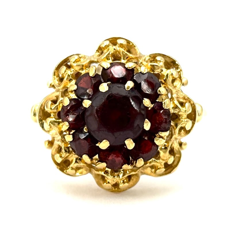 Vintage garnet and gold flower ring; 5.6 gr.: Handcrafted vintage, vexatious and romantic 18 kt yellow gold ring with handcrafted style setting and central garnet flower! A little work of old school goldsmith art! Our company's certification is a
