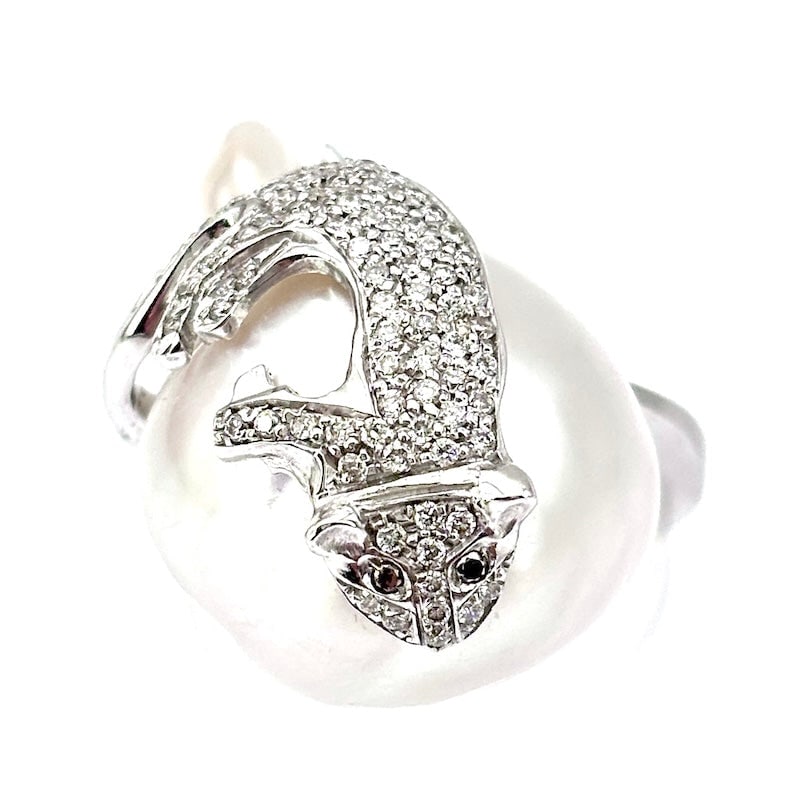 Australian pearl, cat brilliants and white gold ring; 13.74 gr.: Artistic, candid and impressive white gold ring with exclusive 17-26 mm Australian Baroque pearl and diamond cat topping the rare organic gemstone. A fabulous feline jewel!!! Our company's