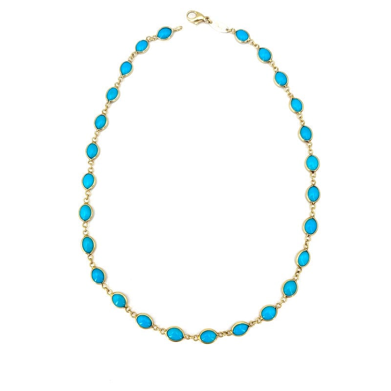 Turquoise and yellow gold paste choker necklace; 14.6 gr - 42 cm: Choker necklace of ovals of an intense turquoise color (turquoise paste), connected and framed by 18 kt yellow gold. The design combines freshness and design, bringing out the contrast between the