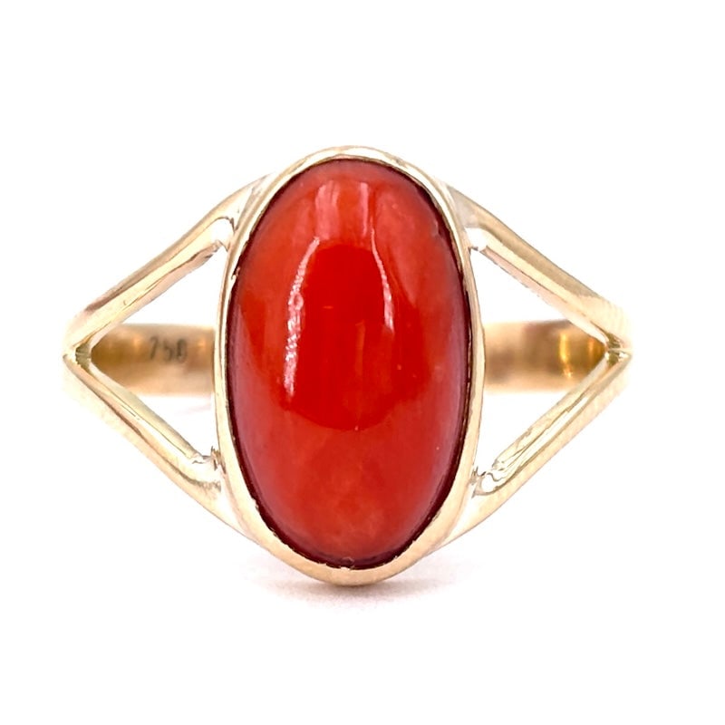 Red coral and yellow gold ring, eye band; 3.56 gr.: Beautiful, essential, yet important 18kt yellow gold, eye band ring with central oval cabochon of natural red Mediterranean coral. Intense, clean, comfortable and passionate jewelry. Our company's cer
