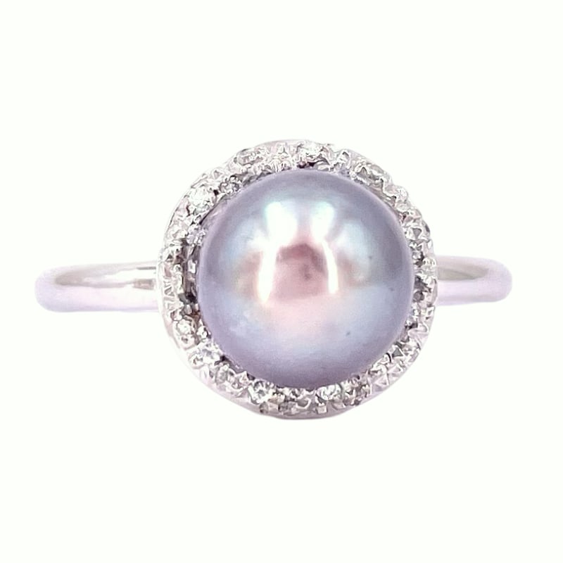 Tahiti pearl ring white gold and brilliants; 7.30 gr.: Ultra chic white gold ring with a sophisticated Tahiti pearl surrounded by diamonds. Essential sinuosity that enhances the contrast between the brilliance of the diamonds and the exotic allure of the