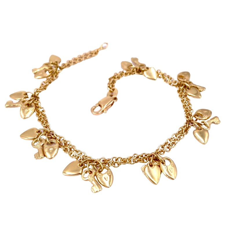 Bracelet charms hearts and keys, yellow gold; 11.16 gr - 16 cm: Very pretty 90s charm bracelet, in 18kt yellow gold, with hanging 8 trio of tinkling charms representing: a heart with a padlock, a key and a little heart. A small, fresh, young artistic delight! Our 