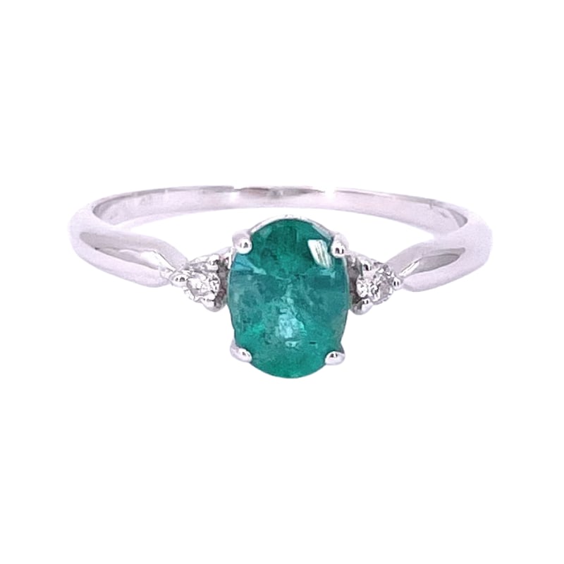 Emerald and side glitter ring, white gold; 1.83 gr.: Graceful and elegant ring with central emerald solitaire and side rhinestones, a jewel, simple, refined, new, offered at outlet price! Our company's certification is available for free, upon request.