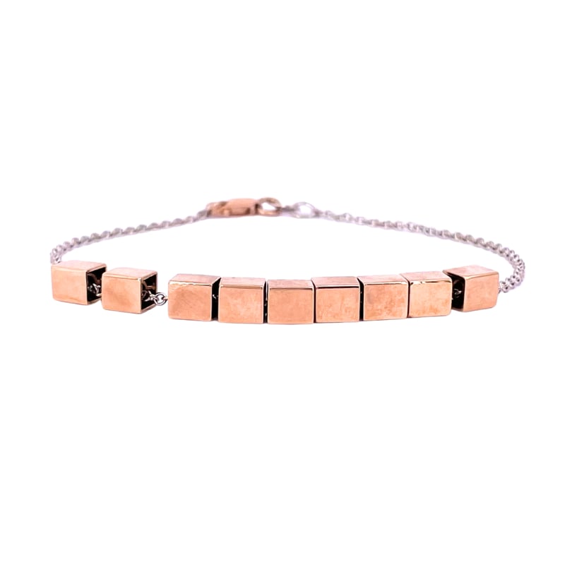 White gold chain bracelet, rose gold cubes; 6.18 gr.: A classic 18 kt white gold chain bracelet with 9 free-flowing rose gold mobile cubes! Versatile, basic and fashionable at the same time! Our company's certification is available for free, upon request