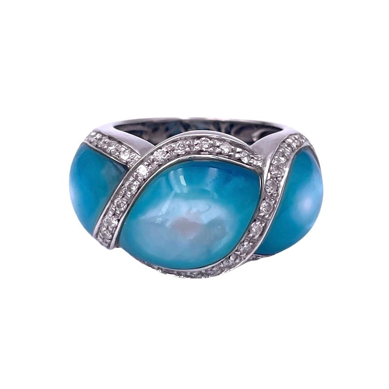 Blue mother-of-pearl, diamond and gold band ring; 14.48 gr.: Intense, unusual and azure! Wide band ring in solid 18 kt white gold, with blue mother-of-pearl (reinforced in color) shaped around bright serpentine brilliants! Our company's certification is availab