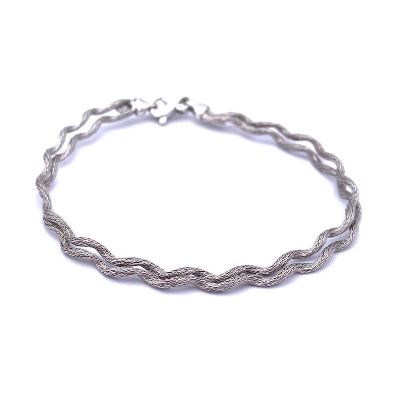 Wave bracelet, white gold, double; 7.6 gr - 18.5 cm: Two chain rat tail semi-rigid wave bracelet with a contemporary and minimal design! 18 kt white gold wave bracelet, lovely, suitable for all ages, absolutely like new! Our company's certification is a