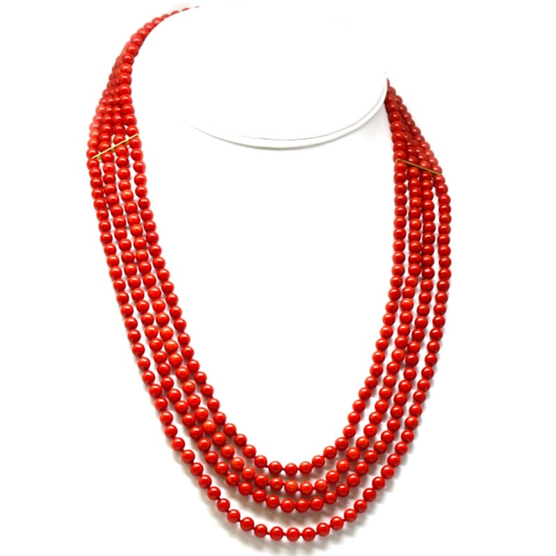 4-strand red coral and gold necklace - 89.3 gr.: Scenic and intense necklace composed of 4 strands of natural Mediterranean red coral, spherical cut, smooth, 5 mm in diameter, with 2.3 cm bars that ensure the order and lay of the strands and with ov