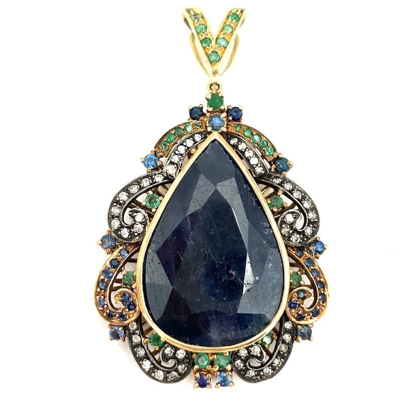 Sapphire, emerald, sapphire and gold maxi drop pendant; 25.5 g: A fabulous, spectacular maxi pendant in antique style made of 14kt gold, with a huge central sapphire drop and an antiqued scroll frame around the perimeter with emeralds and sapphires on silver! Old 