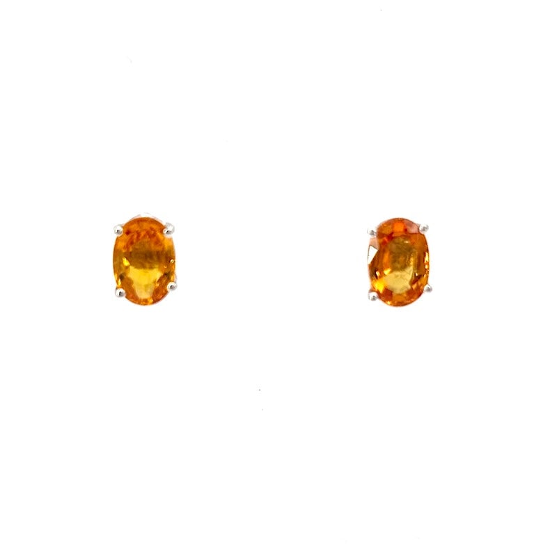 Orange sapphire and white gold stud earrings, IGI certified; 1.34 g: Bright, simple, and intense oval earrings with fabulous orange sapphires, set in 18 kt white gold. Back with pin and butterfly. IGI certified. Large, precious, essential, and beautiful orange light po