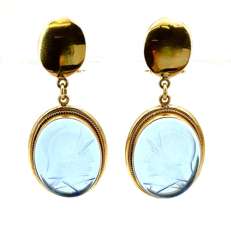 Knight cameo drop earrings in blue glass paste and yellow gold; 12.33 g: An original, colorful, and scenic pair of artistic earrings in 18 kt yellow gold, with oval cameos of knights engraved on blue glass paste. The back only has clips, without a post, which can be added 