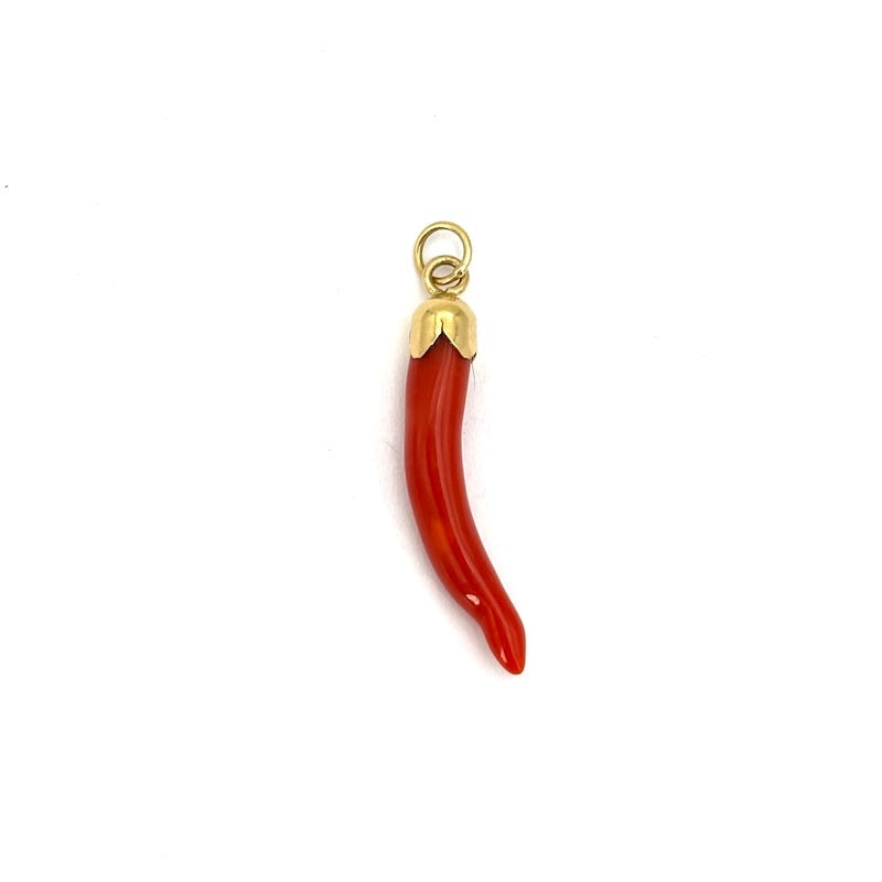 Vintage lucky coral horn charm pendant, 18kt yellow gold; 1.42g: Adorable vintage lucky coral horn pendant in 18kt yellow gold! A tiny gem that makes the much-loved prototype of the red lucky horn a real gem! Our company's certification is available for free upon r