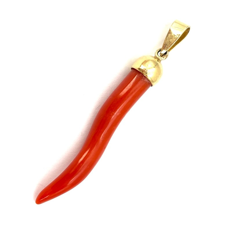 Vintage lucky coral horn charm pendant, 18kt yellow gold; 4.15g: Adorable vintage lucky coral horn pendant in 18kt yellow gold! A little gem that makes the much-loved red horn-shaped lucky charm a true jewel! Our company's certification is available for free upon r