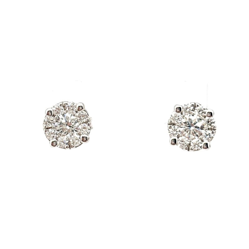 Circular daisy stud earrings in gold and diamonds - 1.12 ct; 3.19 g: Magnificent circular daisy stud earrings in 18kt white gold with 1.12 ct of total brilliant-cut diamonds, F color, VS clarity. Back with post and butterfly. A guarantee of eternal sparkle, importance 