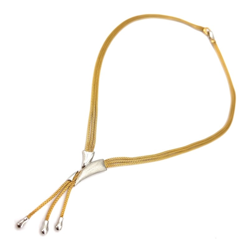 Two-tone gold necklace, Y-shaped choker; 21.86 gr - 44 cm + 5 cm of tassel: A wonderful Y-shaped choker necklace with three yellow gold snake chains and decorative white gold inserts. A sophisticated and versatile necklace. Our