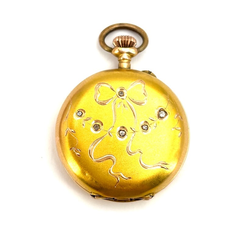 Vintage pocket watch pendant, engraved, 12kt yellow gold and diamonds; 15.17 gr: Superfine charm for this romantic, unique piece of vintage pendant watch from the late 19th/early 20th century, serviced, but guaranteed only as a jewel. Brand: Initial, cylinder movement, and a bow e