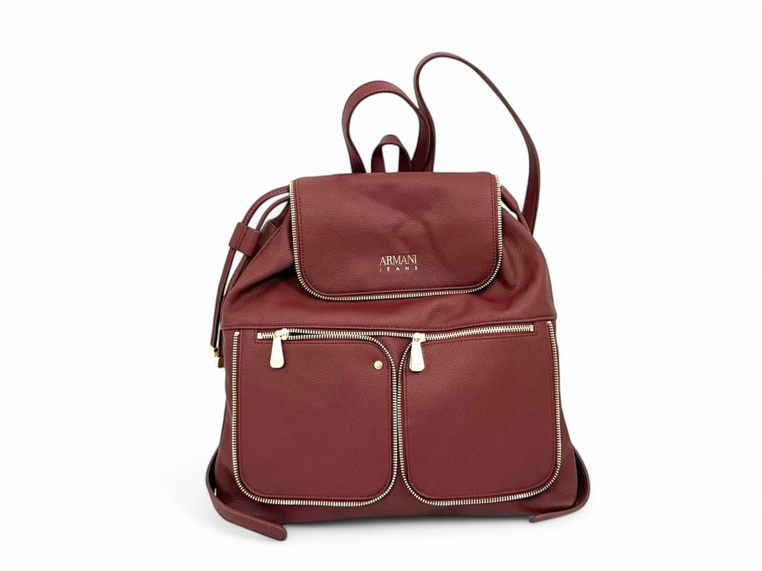 Armani Jeans Bordeaux Leather Backpack Gold Details - Excellent Condition: Stylish Armani Jeans backpack crafted from rich bordeaux leather for a modern urban look. Featuring gold hardware and a spacious design, it blends practicality with casual elegance. In excellent condi