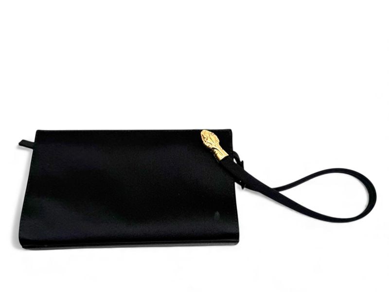 Yves Saint Laurent Black Satin Pochette - Classic Elegance: Refined Yves Saint Laurent pochette crafted from deep black satin, offering a touch of vintage glamour. Adorned with bright gold hardware, this handbag captures a feminine and distinguished style. In 
