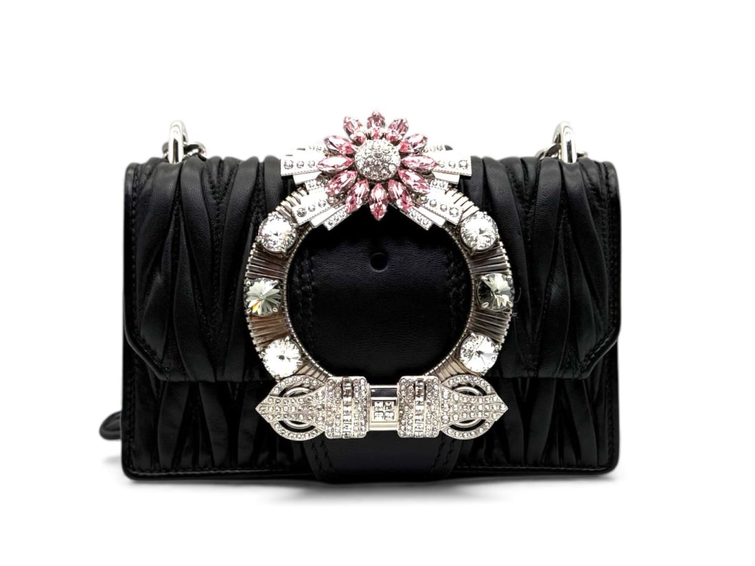 Miu Miu Black Leather Bag Jeweled Clasp - Glamorous & Exclusive: A captivating Miu Miu handbag defined by its exquisite jeweled clasp that adds a touch of high-fashion brilliance. Crafted from premium black leather with sleek silver hardware, this piece seamlessly 