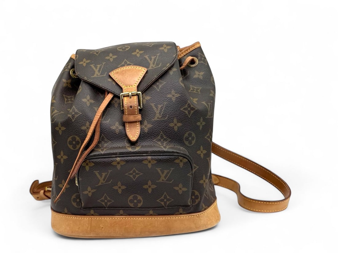 Louis Vuitton Montsouris PM Monogram - Prestigious & Timeless Luxury Backpack: The legendary Louis Vuitton Montsouris PM, a prestigious backpack that seamlessly blends adventure with high-fashion luxury. Crafted in iconic Monogram canvas with natural cowhide trim, its timeless s