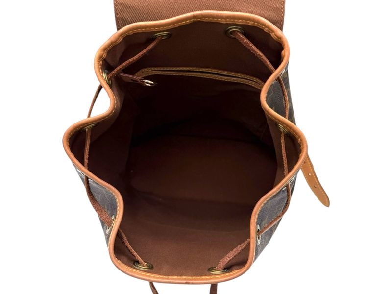 Louis Vuitton Montsouris PM Monogram - Prestigious & Timeless Luxury Backpack: The legendary Louis Vuitton Montsouris PM, a prestigious backpack that seamlessly blends adventure with high-fashion luxury. Crafted in iconic Monogram canvas with natural cowhide trim, its timeless s