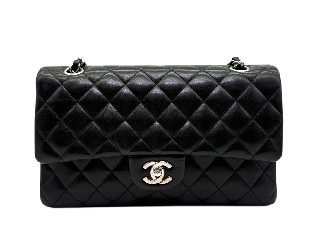 Chanel Timeless 11.12 Medium Lambskin - Absolute & Eternal Icon: The absolute and eternal icon of fashion: the Chanel Timeless 11.12, masterfully crafted from exceptionally soft black lambskin. Featuring polished silver hardware and the signature diamond quilting, 