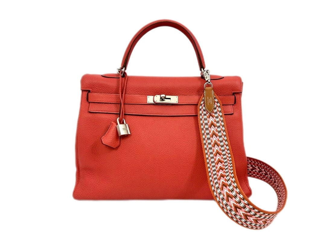 Hermes Kelly 35 Rouge Bougainvillea Clemence - Radiant & Majestic Masterpiece: The breathtaking Hermes Kelly 35, presented in the vibrant and majestic Rouge Bougainvillea Taurillon Clemence leather. Finished with polished Palladium hardware, its iconic silhouette remains the ult