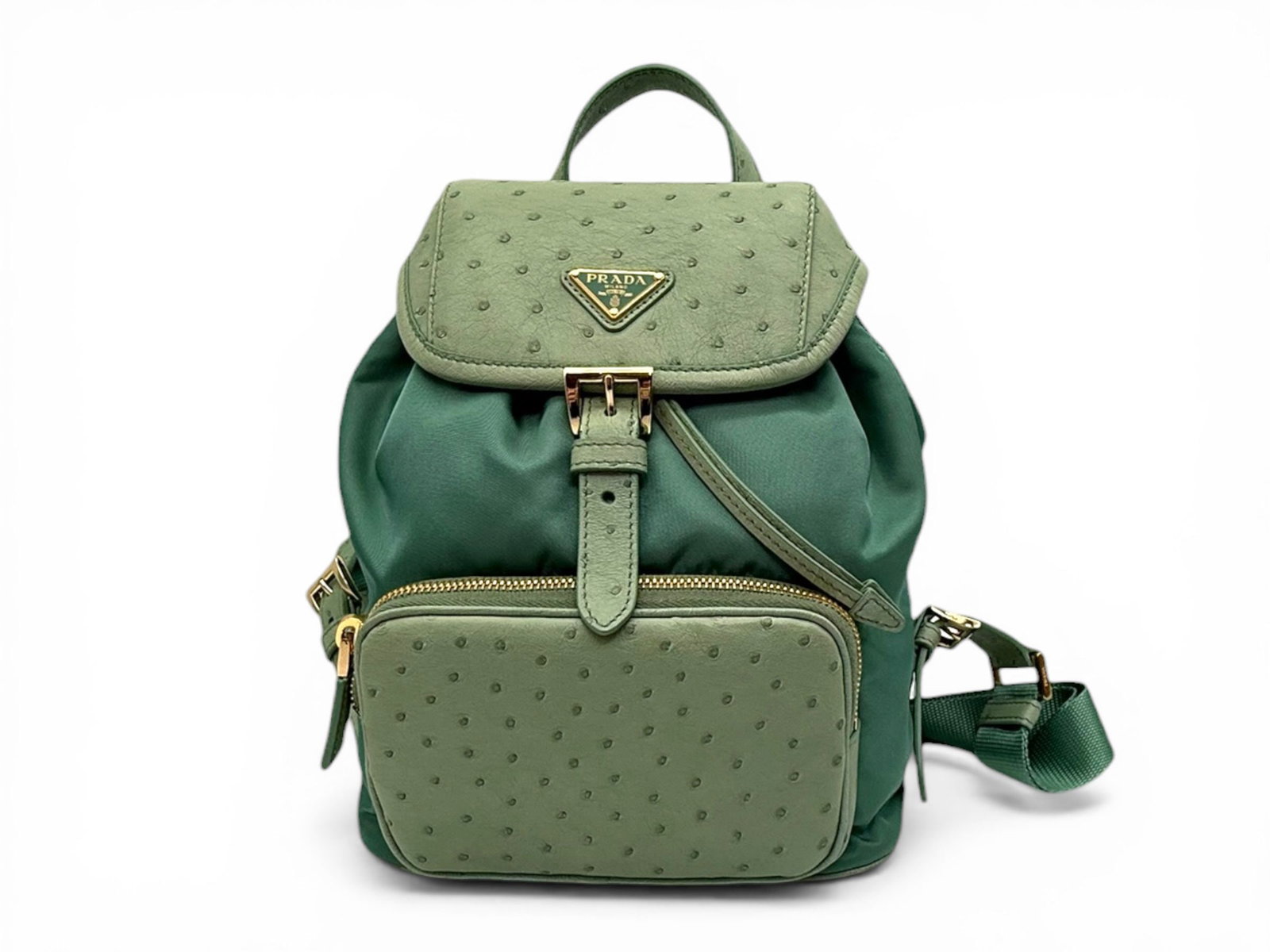 Prada Ostrich Leather Backpack, Mint Green and Gold, Elegant and Modern Luxury Bag: A refined Prada backpack crafted in exotic ostrich leather and canvas, designed to combine modern elegance with everyday practicality. Its soft Mint Green tone paired with gold hardware creates a fres