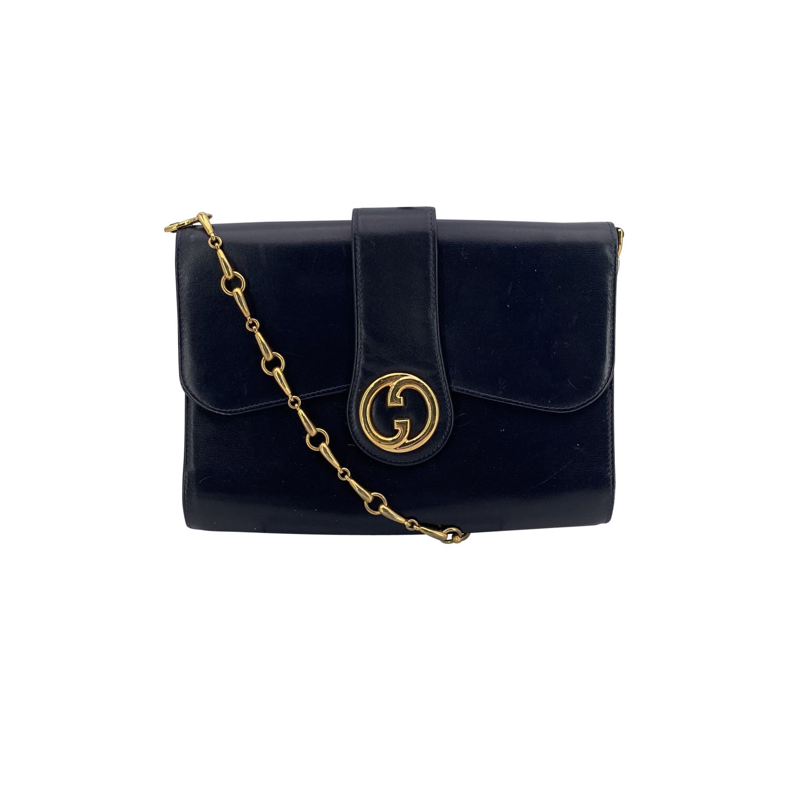 Gucci Vintage Leather Shoulder Bag: A timeless piece from Gucci's elegant past, this vintage navy blue evening shoulder bag channels understated luxury with every detail. The smooth exterior is paired with a beautifully weighted gold-to