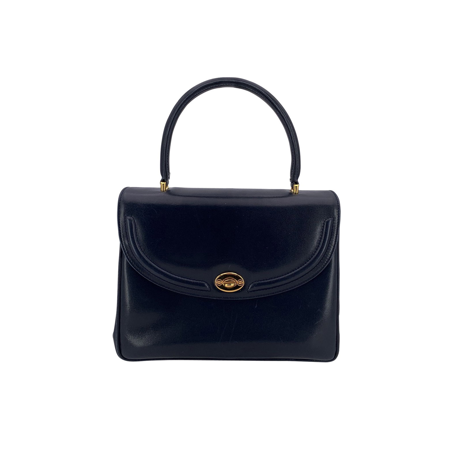 Gucci Vintage Leather Handbag: A timeless piece from Gucci's storied past, this vintage navy blue leather handbag captures the house's signature elegance. Its sculptural bamboo handle-an iconic detail first introduced by Gucci