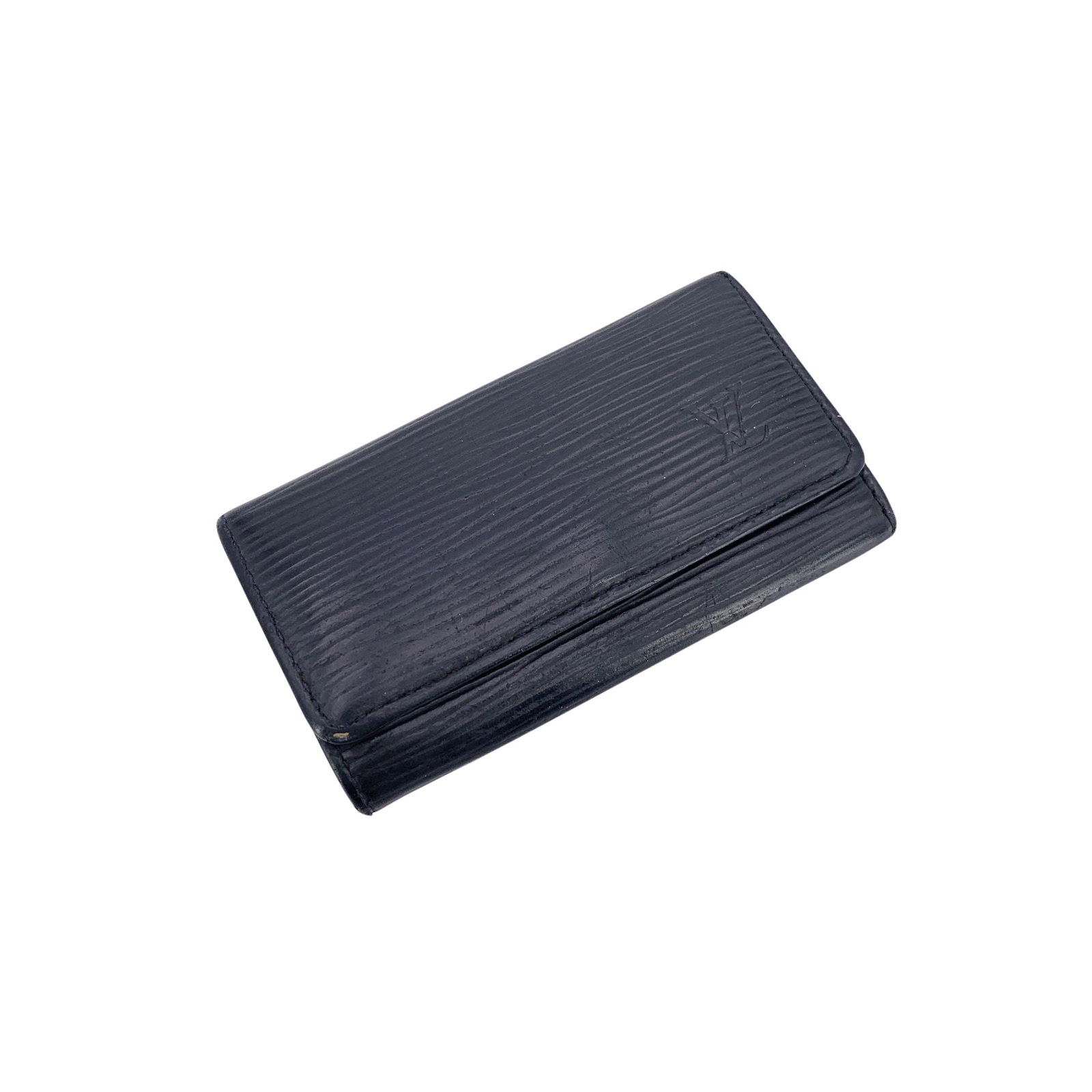 Louis Vuitton Leather Accessory: This elegant Louis Vuitton key case is crafted in durable black Epi leather and finished with a front snap closure for secure, easy access. The interior features a smooth leather lining and four key