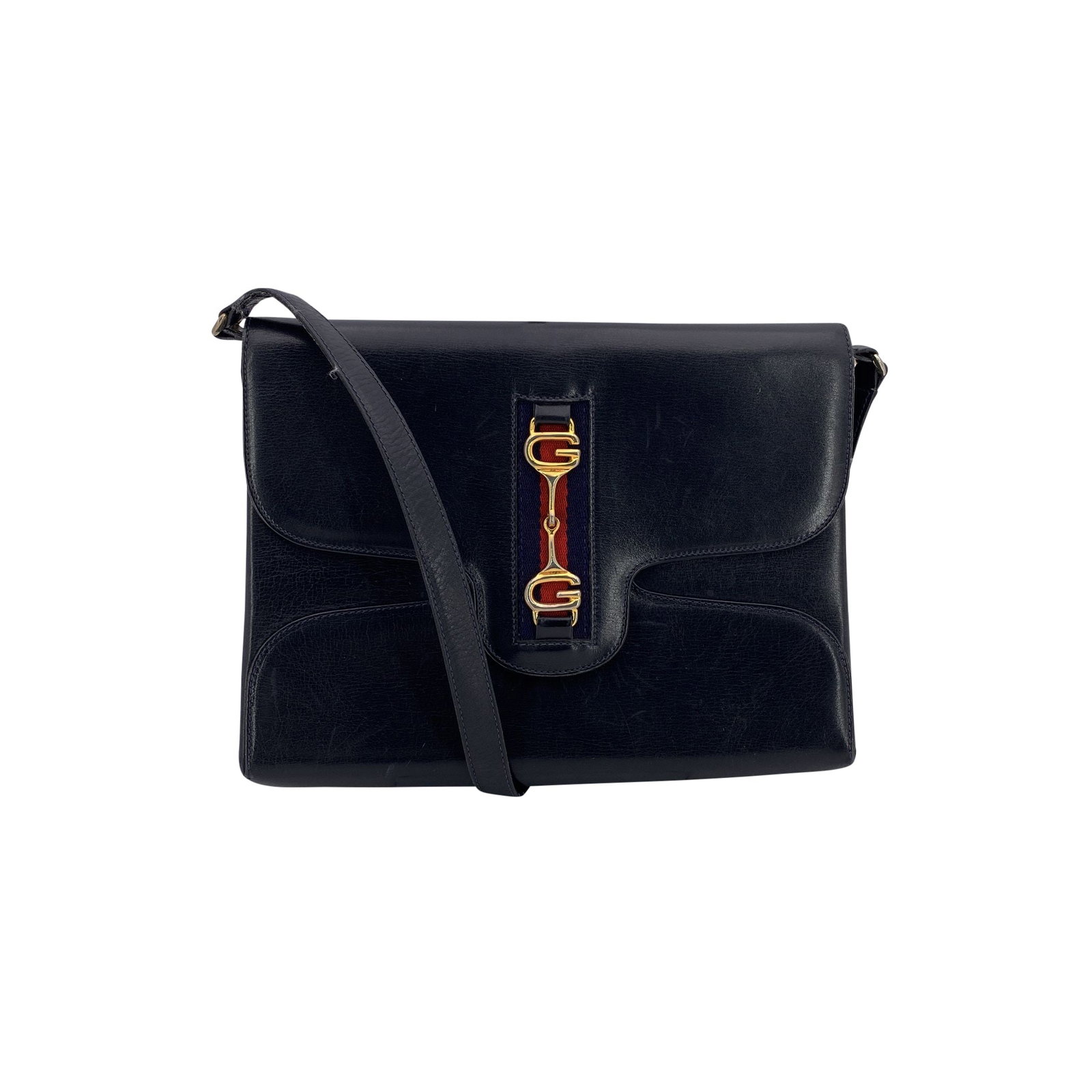 Gucci Vintage Leather Shoulder Bag: A timeless embodiment of understated elegance, this vintage Gucci shoulder bag is crafted in smooth blue leather, designed for those who appreciate the effortless grace of classic Italian style. The s