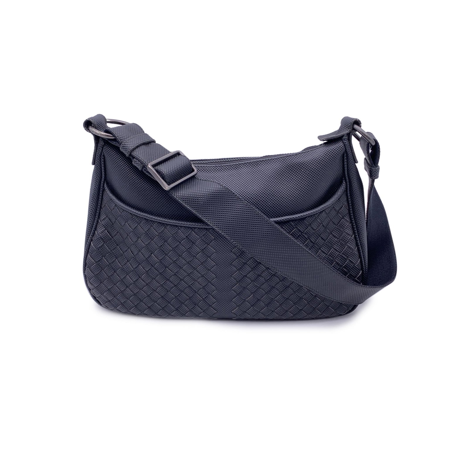 Bottega Veneta Cloth Shoulder Bag Veneta: This Bottega Veneta black canvas shoulder bag showcases the house's iconic Intrecciato design on the front, paired with sleek gunmetal hardware. It features an upper zipper closure and a convenient fr