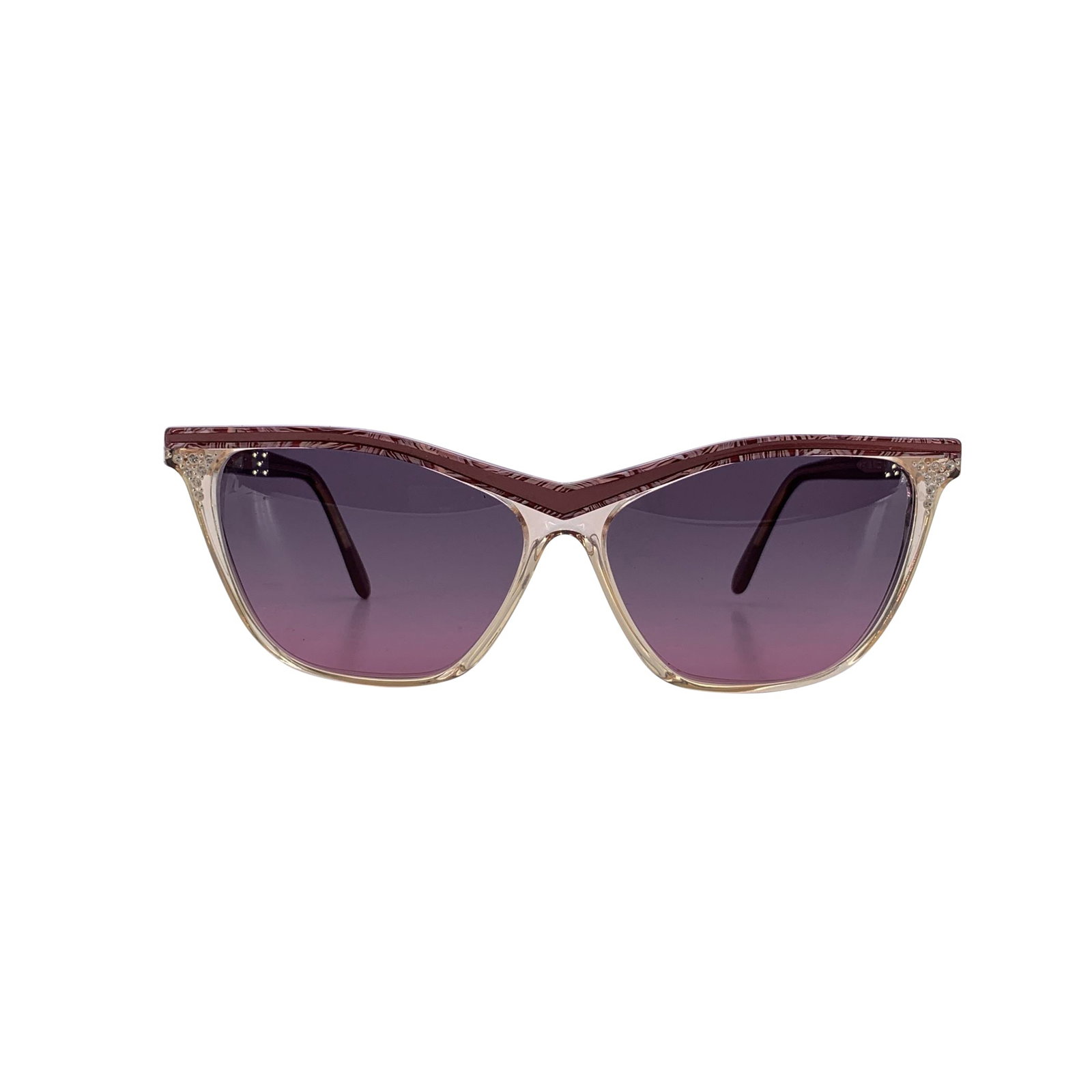 Yves Saint Laurent Vintage Plastic Sunglasses: There's a distinctive 1980s charm woven into these vintage Yves Saint Laurent cat-eye sunglasses-a blend of playful boldness and refined Parisian elegance. Crafted in France from a soft pink plastic, 