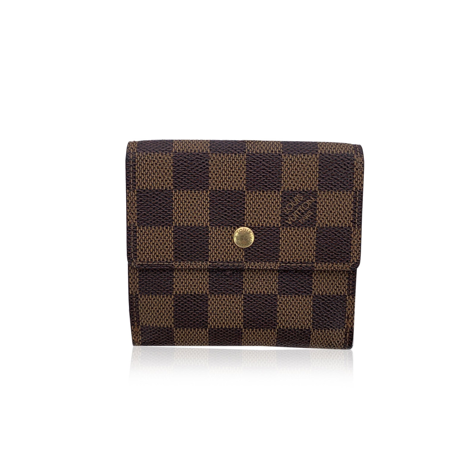 Louis Vuitton Vintage Cloth Wallet: A Classic Treasure from the Archives of Elegance Step into the timeless world of Louis Vuitton with this vintage square-shaped wallet - a rare model that speaks the language of refined functionality a