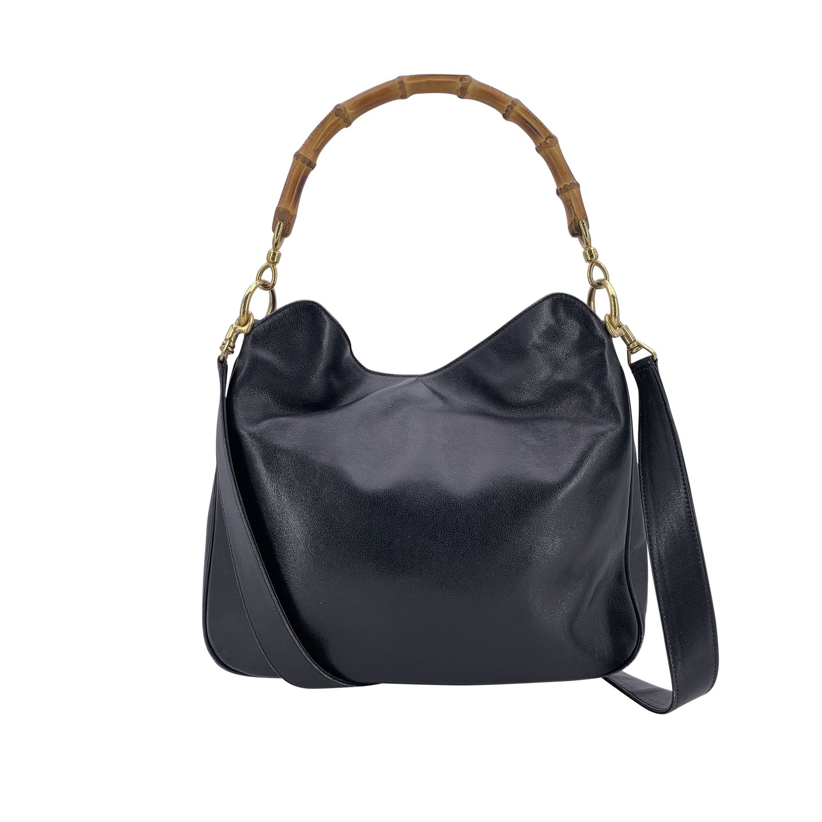 Gucci Vintage Leather Shoulder Bag Bamboo: A timeless piece from Gucci's legacy of craftsmanship, this beautiful black leather hobo bag exudes quiet elegance and vintage charm. Its sculptural bamboo loop handle - an iconic nod to the brand's h