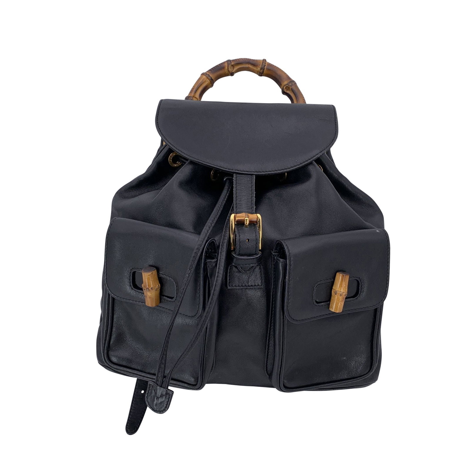 Gucci Vintage Leather Backpack Bamboo: Beautiful vintage Gucci Bamboo backpack in black leather. It features the iconic bamboo handle and bamboo twist-lock closures on all three pockets: one main compartment under the flap and two smaller 