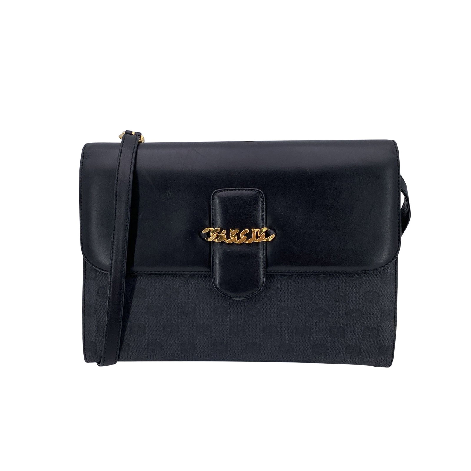 Gucci Vintage Cloth Shoulder Bag: This Gucci vintage convertible bag is a timeless piece crafted from smooth black leather paired with subtle GG-patterned jacquard canvas. Its structured silhouette gives it a classic, elegant look, wh