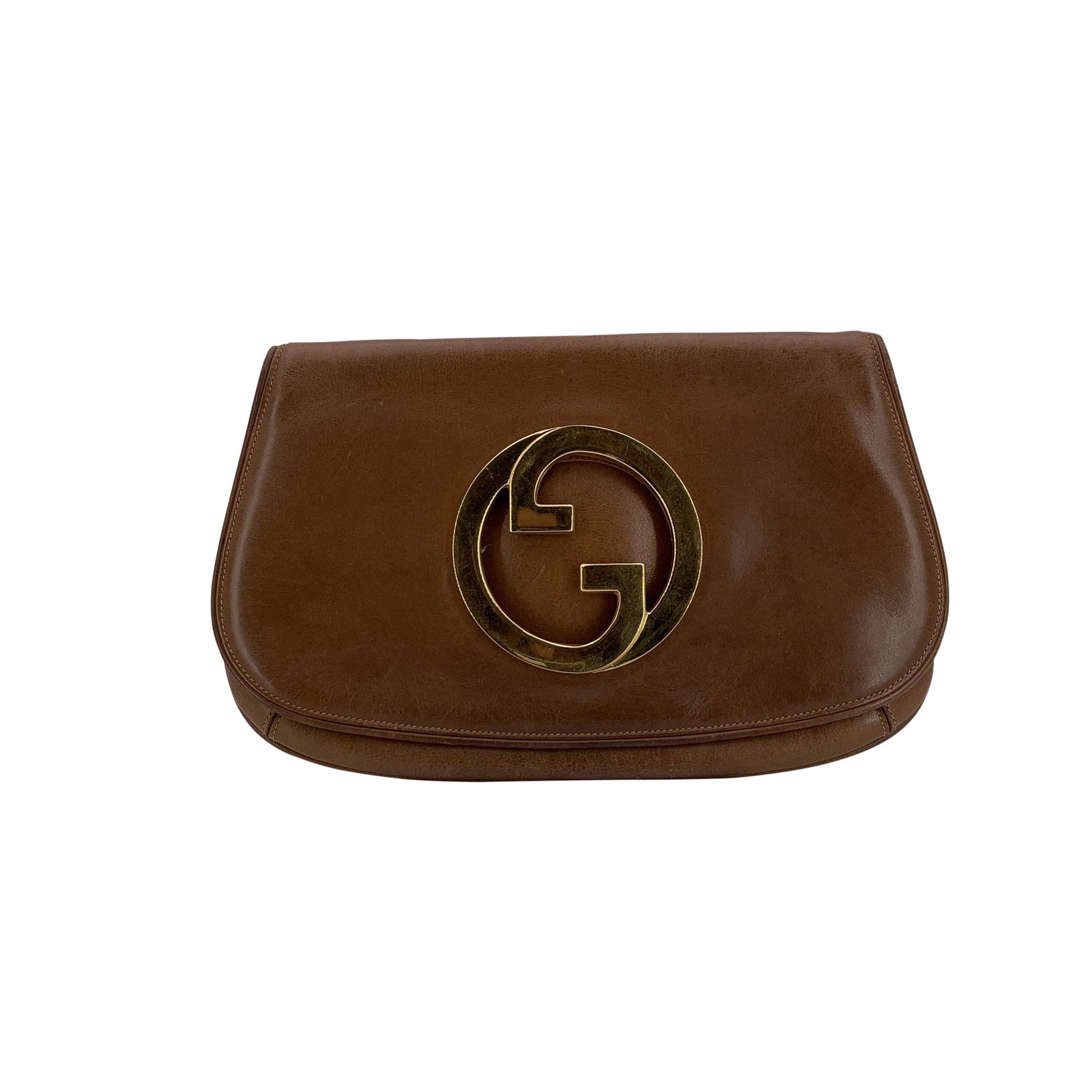 Gucci Vintage Leather Clutch Bag Blondie: This Gucci Vintage Brown Leather GG Blondie Clutch Bag was crafted in Italy during the 1980s and it reflects Gucci's refined aesthetic of the era-clean lines, understated luxury, and impeccable crafts